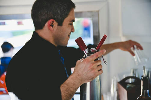 Matt Maroon bartending from the Airstream